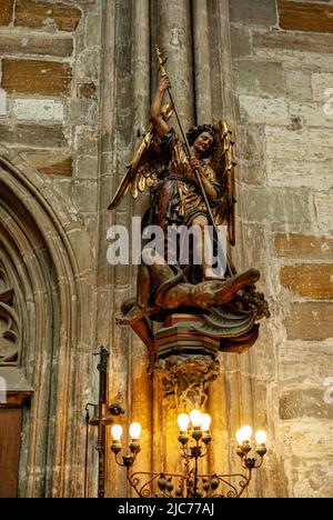Statue of Archangel Michael fighting the devil. St. Vitas Cathedral. Prague, Czech Republic. 09/2007 Stock Photo