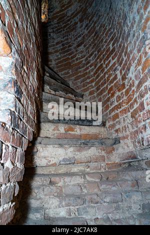 Half-ruined stairs in the ancient tower. Stairs in the ruined tower Stock Photo