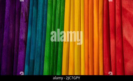 Rainbow gay flag made with wooden sticks creating a texture ideal for backgrounds Stock Photo