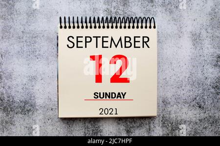 Save the Date written on a calendar - September 12. Stock Photo