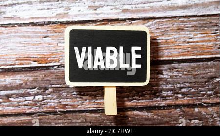 viable colorful word on the wooden background. Stock Photo