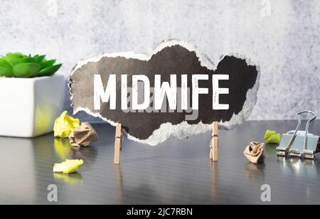 Midwife Word Written In Wooden Cube Stock Photo