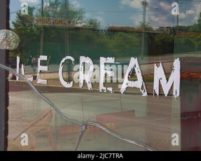 Ice cream sign painted on glass window Stock Photo