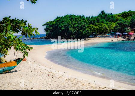 Blue beach in matara Sri Lanka where ocean water meet each other through the sand on the shore where it's calm quiet and beautiful with nature Stock Photo