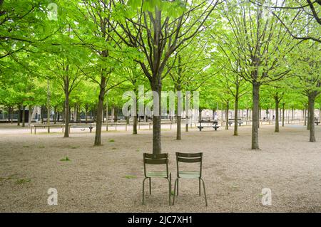 two empty chairs in a paris park Stock Photo