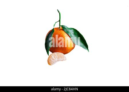 Delicious and beautiful Tangerines with green leaf. Peeled Mandarine orange and Tangerine orange slices isolated on white background Stock Photo