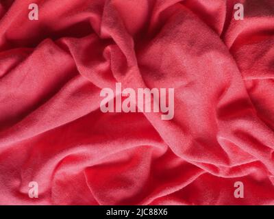 crumpled red fabric texture useful as a background Stock Photo