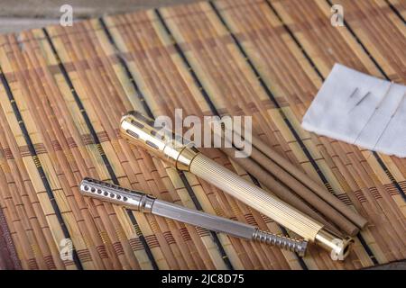 Traditional Chinese herbs used in herbal medicine with acupuncture needles and moxa stick used in moxibustion therapy. Stock Photo