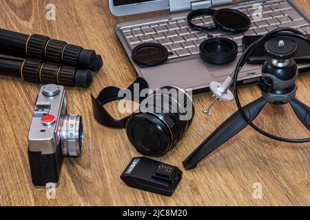 Composition, photo camera with various photographic objects. Stock Photo