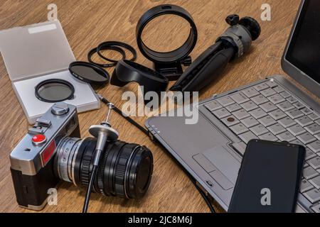 Composition, photo camera with various photographic objects. Stock Photo