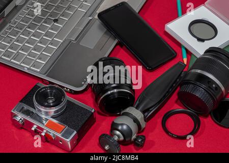 Composition, photo camera with various photographic objects. Stock Photo