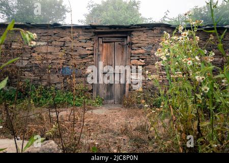 A traditional home in himalayan region of Uttarakhand India made of rocks. These small houses are also called CHANNI means house under stars. Stock Photo