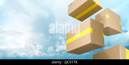 Brown delivery boxes flying on blue sky with clouds background Stock Photo