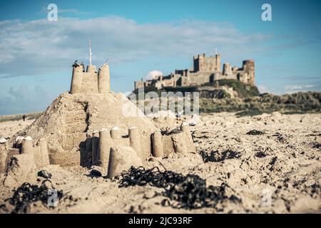 Sandcastle on the Beach, Bamburgh Castle, Northumberland, England Stock Photo