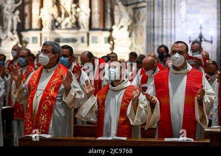 Milan, Italy. 11th June, 2022. Catholic priests pray during the ordination ceremony in Duomo Cathedral in Milan, Italy on June 11, 2022 (Photo by Piero Cruciatti/Sipa USA) Credit: Sipa USA/Alamy Live News Stock Photo