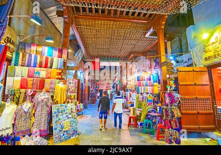 DUBAI, UAE - MARCH 1, 2020: Dubai Old Souk (market) with tourist stalls, spice and perfume shops in bright evening lights, on March 1 in Dubai Stock Photo