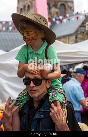 Wimborne, Dorset UK. 11th June 2022. Crowds flock to Wimborne Folk Festival on a warm sunny day to celebrate its 40th birthday with lots of dance groups, music, stalls and other activities around the square and Minster. Credit: Carolyn Jenkins/Alamy Live News Stock Photo