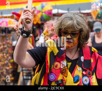 Wimborne, Dorset UK. 11th June 2022. Crowds flock to Wimborne Folk Festival on a warm sunny day to celebrate its 40th birthday with lots of dance groups, music, stalls and other activities around the square and Minster. Credit: Carolyn Jenkins/Alamy Live News Stock Photo
