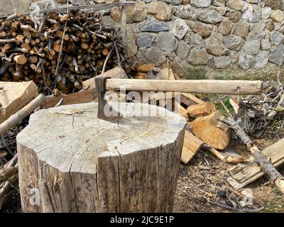 Axe cut in the chopping block. preparing for winter concept. firewood. Stock Photo