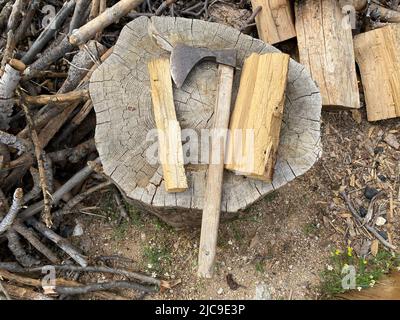 Ax and chopped wood on tree stump. top view of axe and woods. Stock Photo
