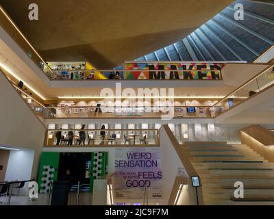 London, Greater London, England, May 28 2022: People browsing inside the Design Museum in Kensington. Stock Photo