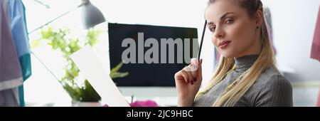 Blonde woman having wonderful idea in her head and wants to realize it Stock Photo