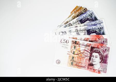 MOSCOW, Russia, February 2020: A bunch of banknotes in denominations of ten, twenty and fifty pounds. Copy space. Stock Photo