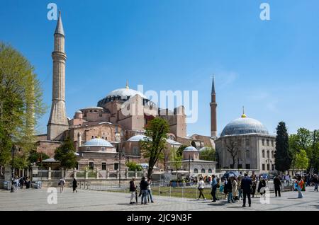 Tourists visiting famed attraction such as Hagia Sophia at Sultanahmet Square, Istanbul, Türkiye. Stock Photo