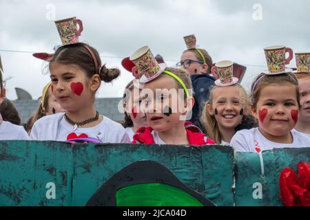 Strathaven, Scotland, UK. 11th June, 2022. A scene from The Mad Hatter's tea-party, from Alice in Wonderland by Lewis Carroll at the Strathaven Gala as it makes a return after a two year absence due to the Covid-19 pandemic. Credit: Skully/Alamy Live News Stock Photo