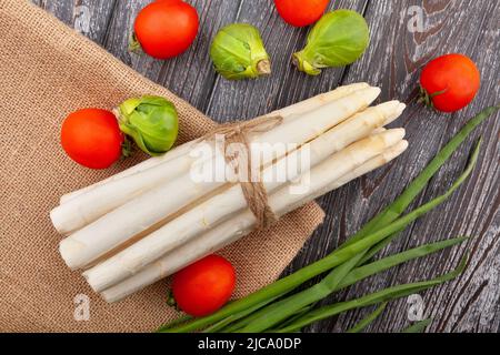 white asparagus on wood background top view Stock Photo