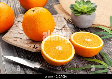 sliced oranges on wood background Stock Photo