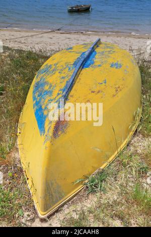 Yellow boat ashore on the sand banks of the Ria do Alvor Estuary. Portimao-Portugal-321 Stock Photo