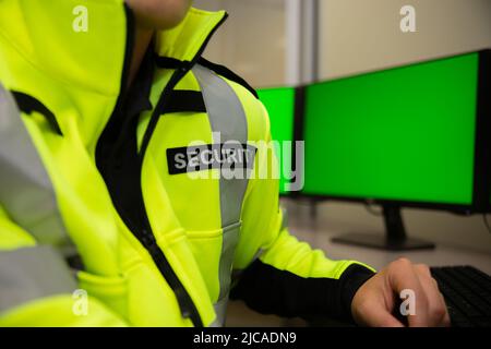 Security team watching over CCTV surveillance monitors. Stock Photo