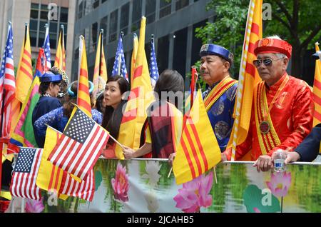 Tibetian participants are seen posing for a photo on Fifth Avenue in New York City during the 37th Annual NYC Immigrants Parade to celebrate Immigrant Stock Photo