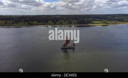 An aerial view of an old Thames Sailing Barge on the River Orwell in Suffolk, UK Stock Photo