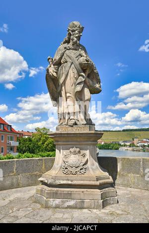 Würzburg, Germany - June 2022: Sculpture of Charles the Great at famous old Main bridge called 'Alte Mainbrücke' Stock Photo