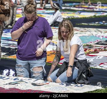 San Francisco, United States. 11th June, 2022. Visitors view the AIDS Memorial Quilt on its 35th anniversary in Robin Williams meadow in Golden Gate Park on Saturday, June 11, 2022 in San Francisco. Three thousand panels of the quilt were displayed, each dedicated to a person who died of AIDS. Photo by Terry Schmitt/UPI Credit: UPI/Alamy Live News