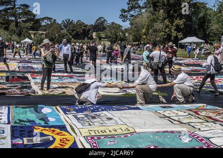 San Francisco, United States. 11th June, 2022. Visitors view the AIDS Memorial Quilt on its 35th anniversary in Robin Williams meadow in Golden Gate Park on Saturday, June 11, 2022 in San Francisco. 3,000 panels of the quilt were displayed, each dedicated to a person who died of AIDS. Photo by Terry Schmitt/UPI Credit: UPI/Alamy Live News