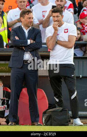 Rotterdam, Netherlands. 12th June, 2022. The Polish press officer Jakub Kwiatkowski with Robert Lewandowski of Poland during the UEFA Nations League, League A, Group 4 match between Netherlands and Poland at Feijenoord 'De Kuip' Stadium in Rotterdam, Netherlands on June 11, 2022 (Photo by Andrew SURMA/ Credit: Sipa USA/Alamy Live News Stock Photo