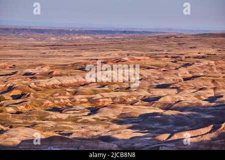 South Dakota Badlands endless waves of color in sunrise Stock Photo