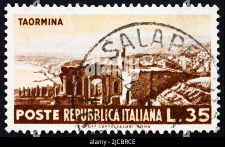 ITALY - CIRCA 1953: a stamp printed in the Italy shows View of Roman Ruins, Taormina, circa 1953 Stock Photo