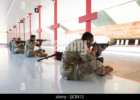 May 17, 2022 - Travis Air Force Base, California, USA - U.S. Air Force Capt. Marquis Taylor, 60th Mission Support Group executive officer, right, aims at his paper target using an M4 carbine during a National Police Week event at Travis Air Force Base, California, May 17, 2022. The 60th SFS celebrated National Police Week by organizing events to honor all Defenders, Masters-at-Arms, Air Force Office of Special Investigations members and law enforcement officers who have served, are currently serving and those who have paid the ultimate sacrifice. (Credit Image: © U.S. Air Force/ZUMA Press Wire Stock Photo