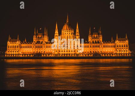 Hungarian parliament building from across the Danube river at night. Stock Photo