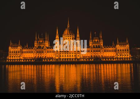 Hungarian parliament building from across the Danube river at night. Stock Photo