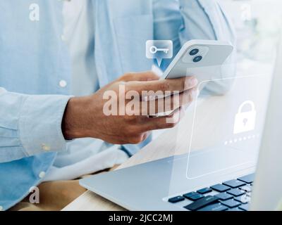 Two factor authentication or 2FA concept. Virtual key icon while access on phone with laptop for validate password, Identity verification, cybersecuri Stock Photo