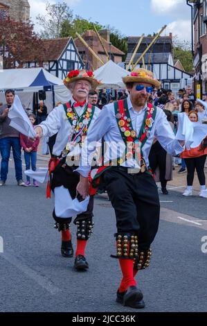 Merrydowners Morris dancers on Pinner High Street at St George’s Day Celebration 2022. Northwest London, England. Stock Photo