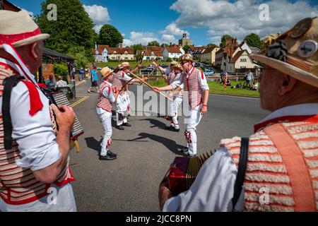 Thaxted, Essex, UK. 11th June 2022.  Thaxted Morris Men perform in Finchingfield Essex Fourteen Morris Dancing sides danced through 14 villages in north west Essex for the first time since Covid restrictions were lifted for the Thaxted Morris Weekend. The evening concluded just after 10pm. Credit: BRIAN HARRIS/Alamy Live News Stock Photo