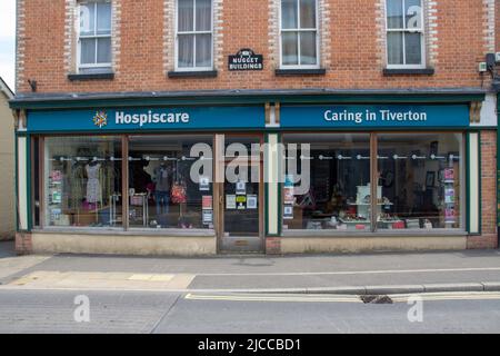 TIVERTON, UK - JUNE 30, 2021 branch of Hospiscare charity shop on Gold Street Stock Photo