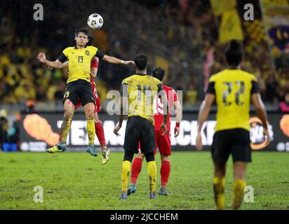Kuala Lumpur, Malaysia. 11th June, 2022. Ahmad Syihan Hazmi (L) of Malaysia in action during the AFC Asian Cup 2023 qualifiers match between Malaysia and Bahrain at the National Stadium Bukit Jalil. Final score; Bahrain 2:1 Malaysia. Credit: SOPA Images Limited/Alamy Live News Stock Photo