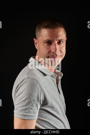 A young man posing in a studio Stock Photo